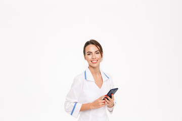 Fototapeta premium Confident young woman doctor wearing uniform