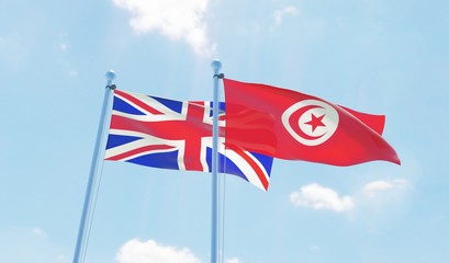 Tunisia and United Kingdom, two flags waving against blue sky. 3d image