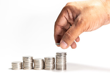 Pile of silver coins with hand