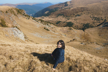 smiling woman on top of transalpina hill