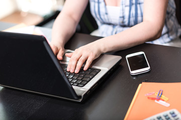 Female hands using a laptop