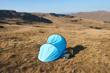 blue tent in transalpina field