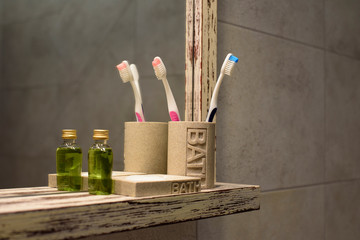Bathroom mirror with shelf and toothbrashes