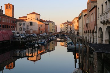 Fototapeta na wymiar Chioggia, Veneto, Italy. View of the town so called little Venice on one of the bridge of the canal Vena.