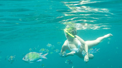 girl and snorkeling mask