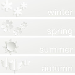 Four seasons horizontal banners. Four banners, one for each of the seasons of the year. Vector illustration that simulates the cut out paper style. 
