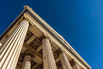 Classical marble pillars detail on the facade of a building
