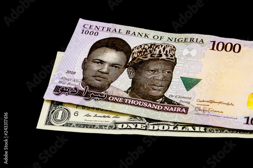 Nigerian Naira Note On A Us Dollar Bill International Trade Nigerian Naira Note On A Us Dollar Bill International Trade Globalization