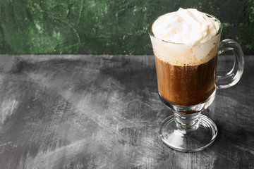 Irish coffee with whisky on dark background. Copy space. Food background