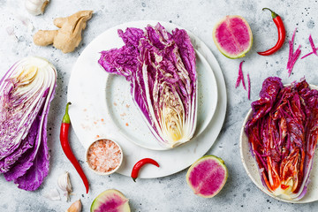 Cabbage kimchi, top view. Preparing purple cabbage and watermelon radish kimchi. Fermented and...