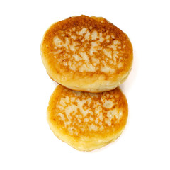 Freshly baked cheese pancakes isolated on white background. Top view