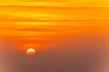 Beautiful blazing sunset landscape and orange sky above it. Amazing summer sunrise as a background.