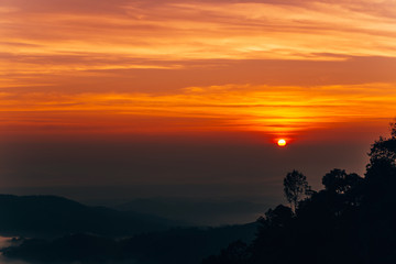 Mountain Mist in sunrise,mist on sunrise,mist over mountain during sunrise.Beautiful landscape in the mountains at sunrise.