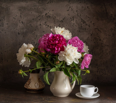 Still life with white and pink peonies.