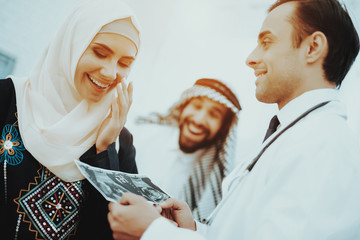 Happy Pregnancy Muslim Woman Hold Ultrasound Image