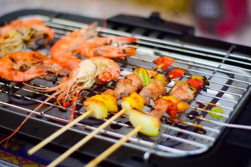 Steak and sauce on the table with dipping sauce on the meat, decorated with vegetables and french...