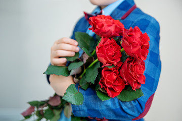 Red roses in hands