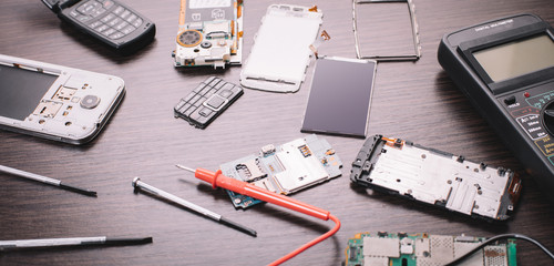 disassembled mobile phone and tools