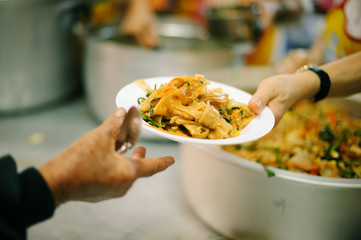 Providing food to the poor is helping sharing from fellow humans together : Concept of famine and...