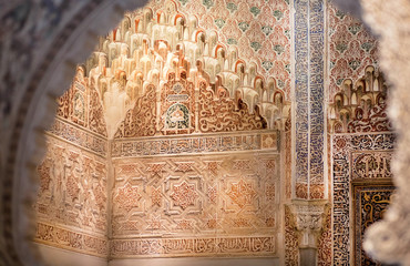 Beautiful interior with patterns on historical arabic style walls, 14th century Madraza de Granada,...
