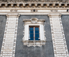 Upper part with an ancient window of the Palazzo del Seminario dei Chierici in Catania