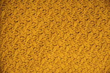 Stack of Warm knitwear close-up. Woolen knit texture as background