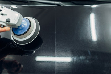 Car hood before and after polishing process