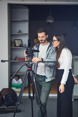 Cameraman showing the footage to the actor