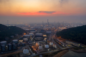 Fototapeta premium Aerial view. oil refinery factory and Oil industry at sunrise. Petrochemical Industrial.