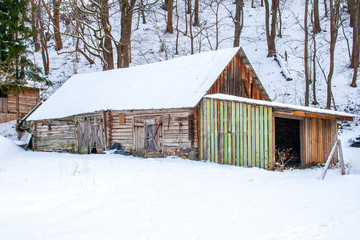 Wooden house in the wood in winter, with snow, Lithuania