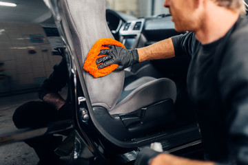 Chemical cleaning of car seats using special agent