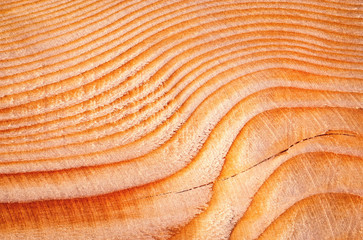 lines and waves on a wooden faceted board