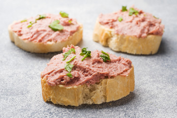 Sandwiches with chicken pate and butter on the table.