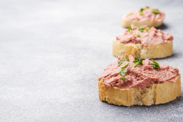 Sandwiches with chicken pate and butter on the table.