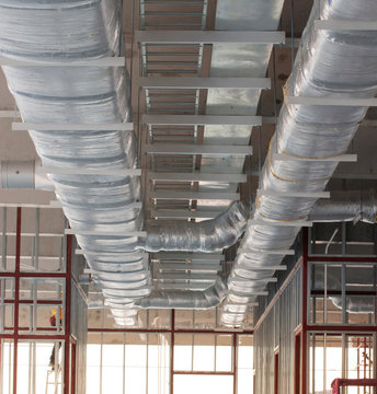 Typical installation of ducting with fiberglass insulation work combine with cable tray and fire fighting pipe