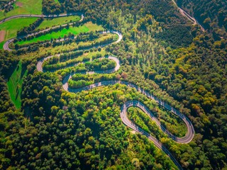 Serpentine road in Bieszczady mountains photographed from drone