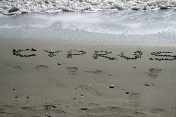 The word Cyprus written on the sand 