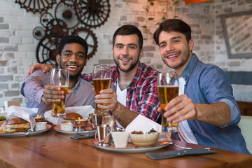 Friends meeting. Men sitting in beer pub