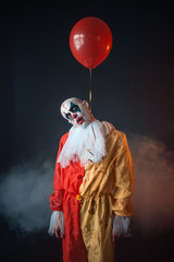Mad bloody clown hung himself on air balloon