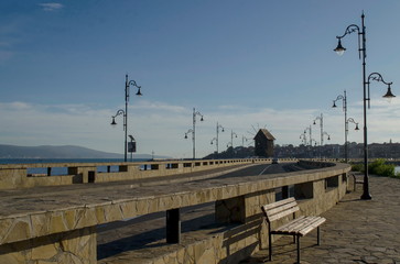 Isthmus to old Nessebar in Black sea Bulgaria. The windmill is wooden.
