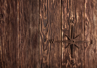 wood texture. background old panels with wooden compass