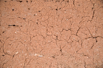 Old wall plastered with mud closeup