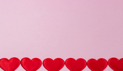 Valentine's red hearts laid out in a row