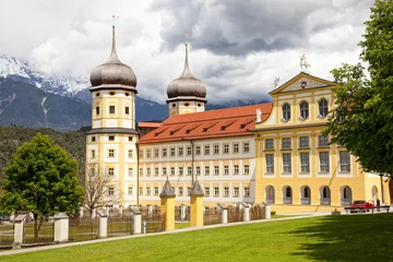 Fotobehang Exterior of the stams Abbey (Stift Stams) established by Cistercian monks in 1273 in Tyrol, Austria and later revamped in Baroque style. © Studio F.