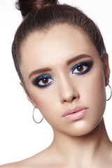 Beautiful Woman with Professional Makeup. Celebrate Style Eye Make-up, Perfect Eyebrows, Shine Skin. Bright Fashion Look