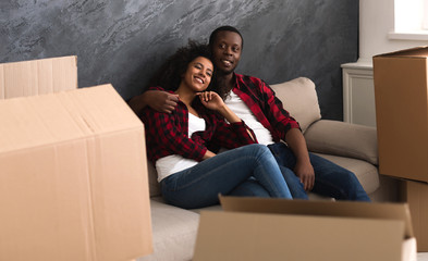 Happy Afro American couple at new apartment