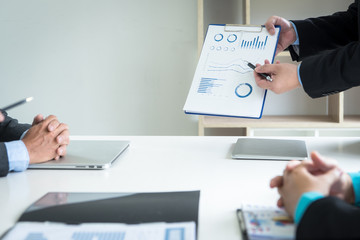 Professional investor meeting present time.Business crew working with new startup,Teamwork concept,discussion document in office.Collaborative filtering.Analyze plans.selective focus,vintage effect.