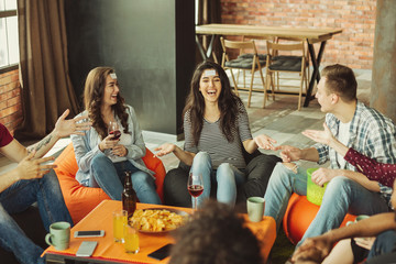 Friends playing forhead game at home