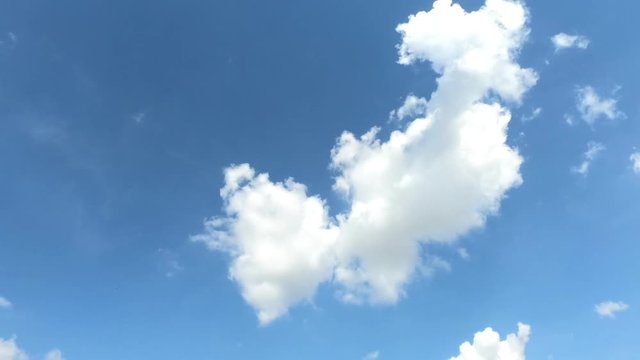 Time lapse,sky beautiful cloud scape white fluffy clouds over blue sky.