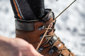tying shoelaces, tying shoe laces on snow